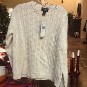 Lauren Ralph Lauren cableknit cotton sweater with crew neck and long sleeves.